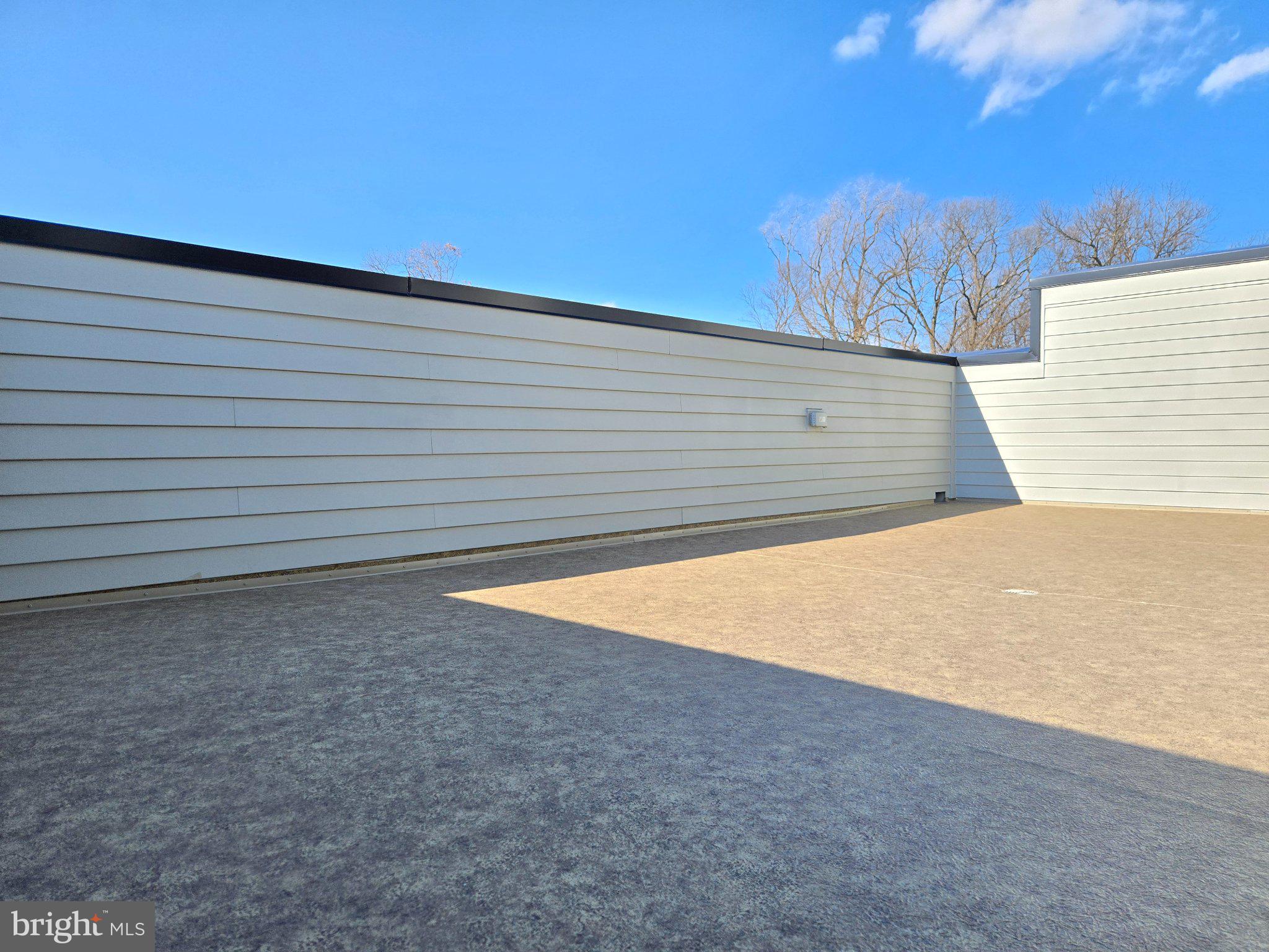 2106 Tysons Ridgeline Road Falls Church, VA 22043 - Photo 20 of 28 Spacious rooftop with clear blue skies.