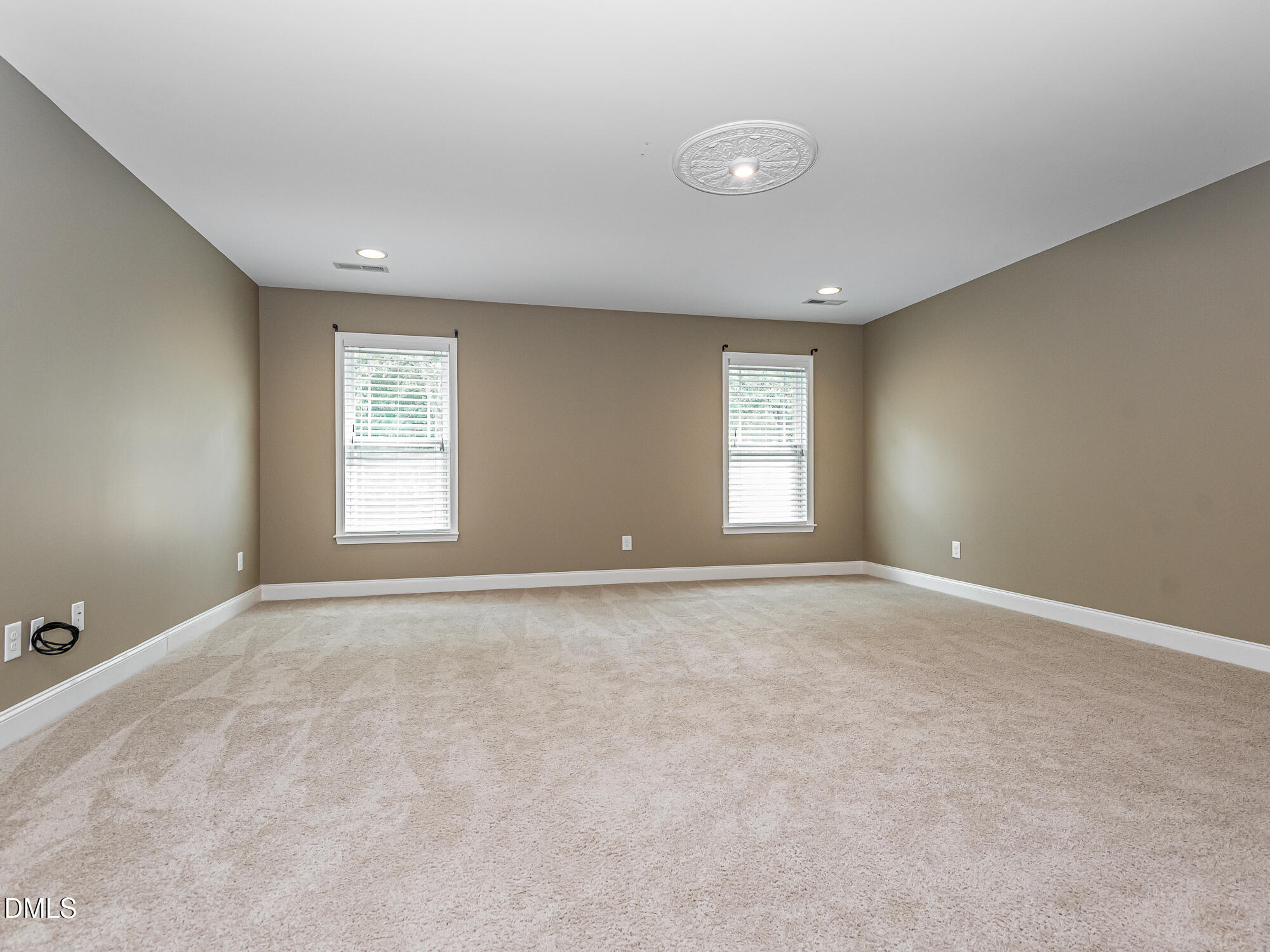 337 Shadowdale Lane Rolesville, NC 27571 - Photo 21 of 42 an empty room with windows