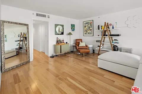 a bathroom with a bathtub a mirror a sink and vanity