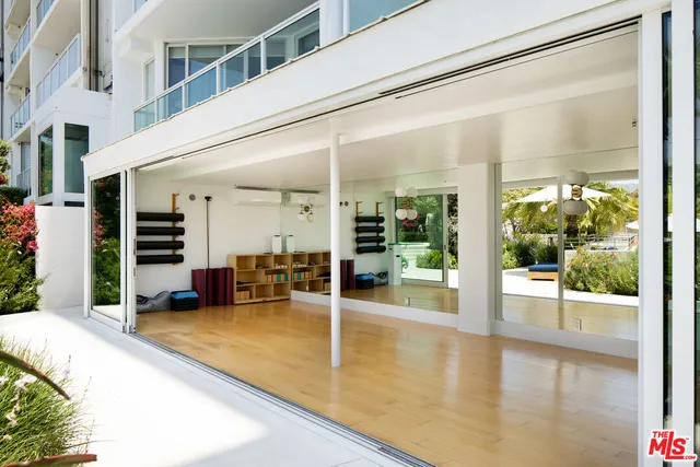 a view of a patio with swimming pool