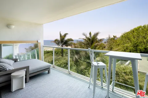a view of a livingroom with furniture and window