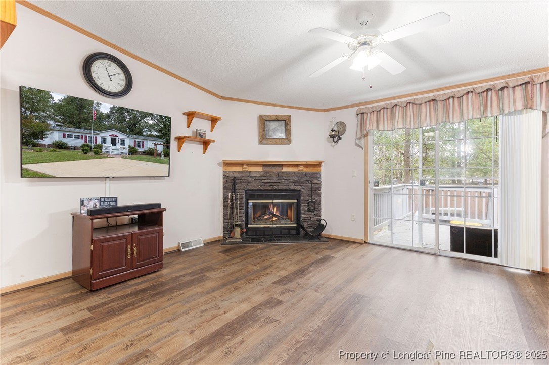 520 Inverary Drive Raeford, NC 28376 - Photo 11 of 43 wooden floor fireplace and windows in an empty room