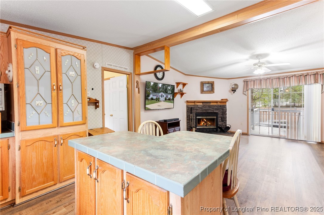 520 Inverary Drive Raeford, NC 28376 - Photo 15 of 43 a view of a kitchen with furniture and fireplace