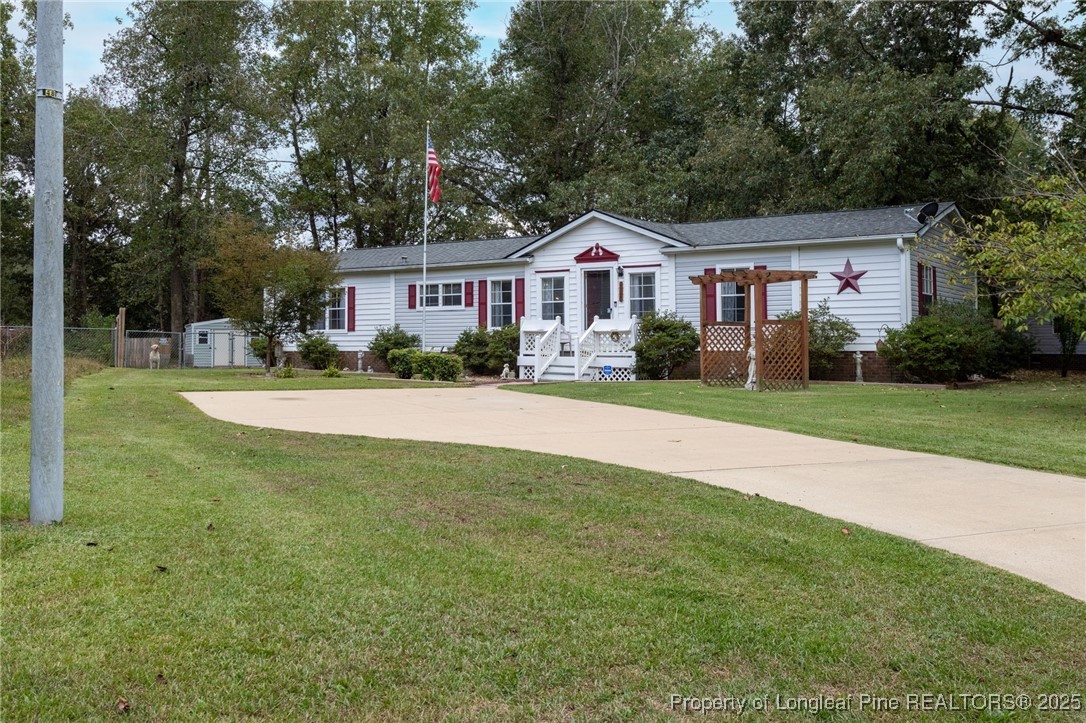 520 Inverary Drive Raeford, NC 28376 - Photo 2 of 43 a front view of a house with a yard