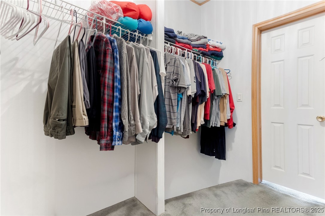 520 Inverary Drive Raeford, NC 28376 - Photo 21 of 43 a view of walk in closet with clothes