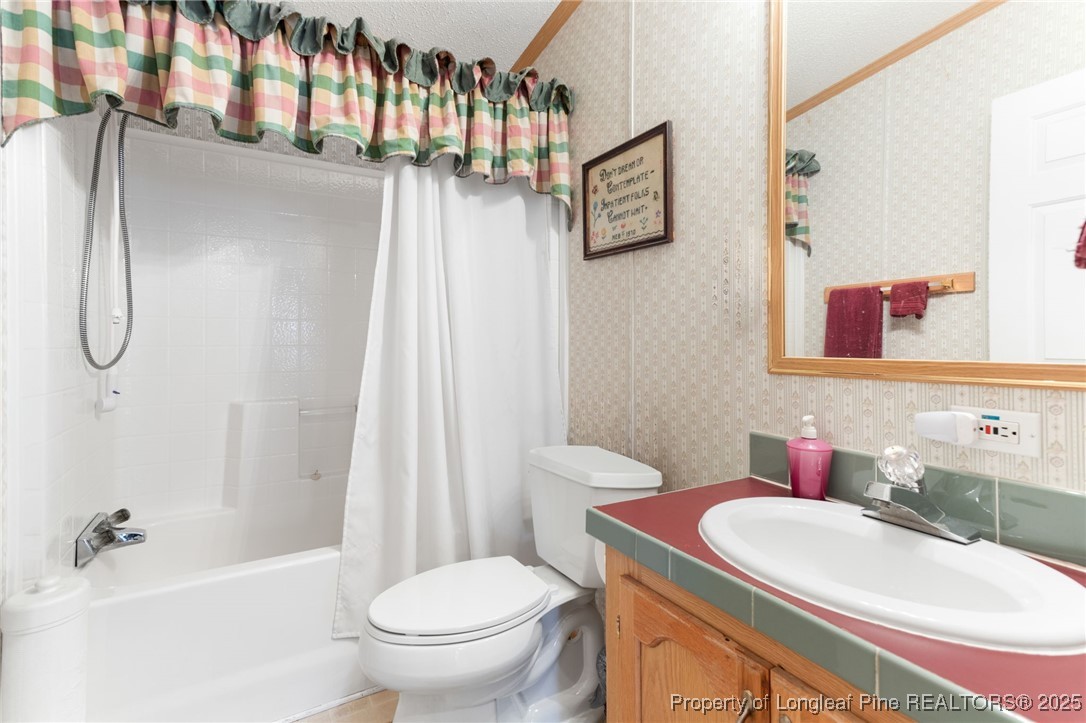 520 Inverary Drive Raeford, NC 28376 - Photo 27 of 43 a bathroom with a sink toilet and shower