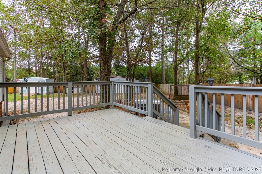 520 Inverary Drive Raeford, NC 28376 - Photo 30 of 43 a view of deck with wooden floor and fence
