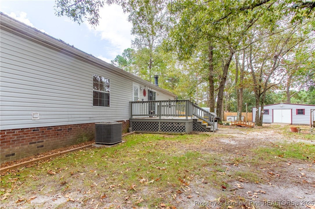 520 Inverary Drive Raeford, NC 28376 - Photo 38 of 43 a view of a house with a backyard and a tree