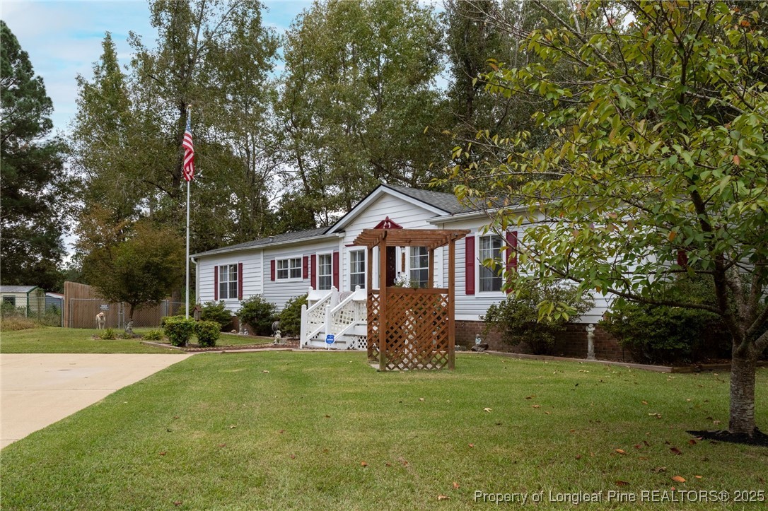 520 Inverary Drive Raeford, NC 28376 - Photo 5 of 43 a front view of a house with garden