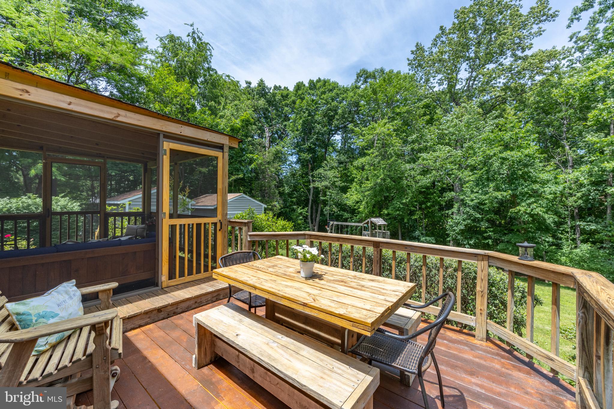 164 Oliver Lane Ruckersville, VA 22968 - Photo 10 of 39 Serene deck nestled in lush greenery.