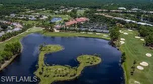 an aerial view of a house with yard swimming pool and outdoor seating