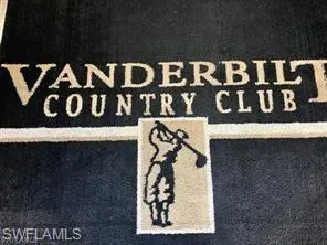 a street sign that is on a wooden wall