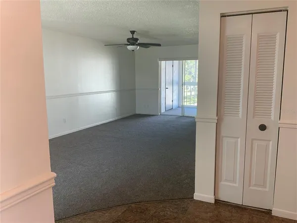 a view of empty room with windows