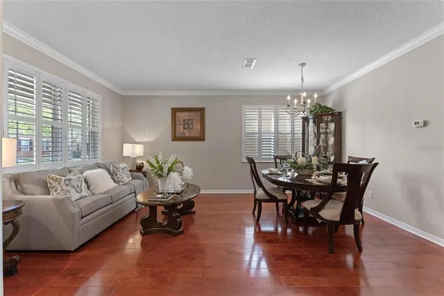 a view of entryway livingroom and hall with wooden floor