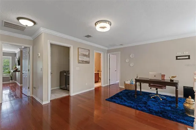 a bathroom with a tub a sink and mirror