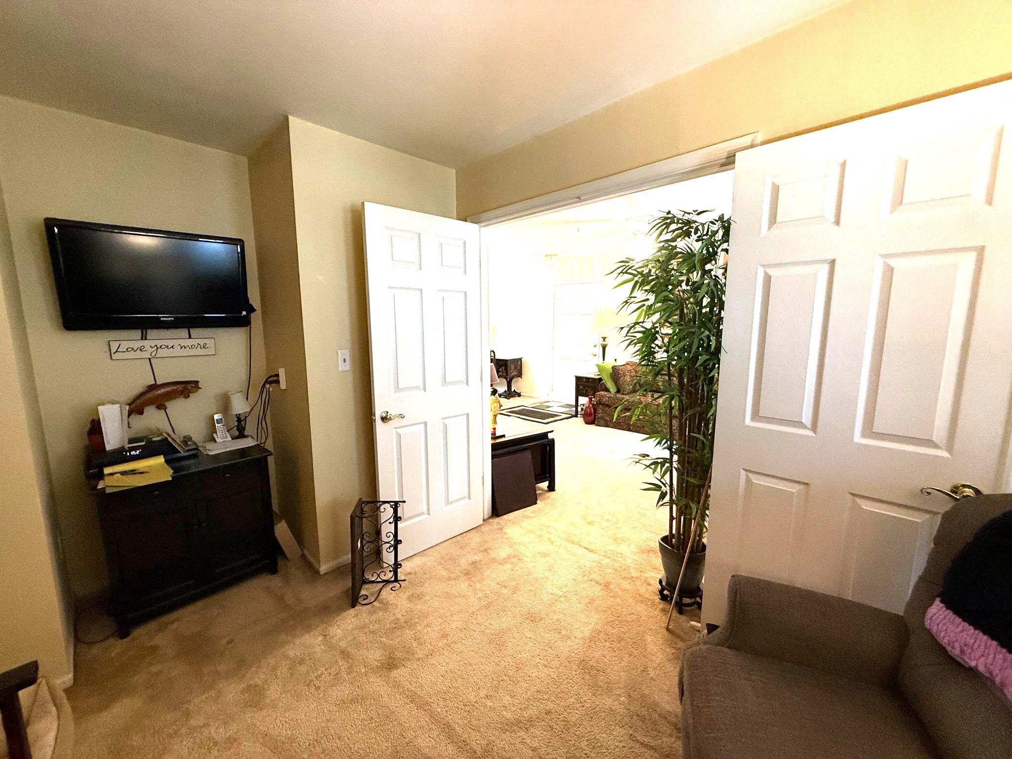 302 Canterbury Road, Unit 302E Bel Air, MD 21014 - Photo 23 of 39 a living room with furniture and a flat screen tv