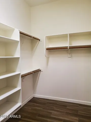 a view of an empty walk in closet