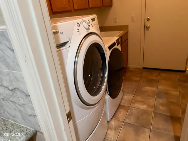 a utility room with dryer and washer