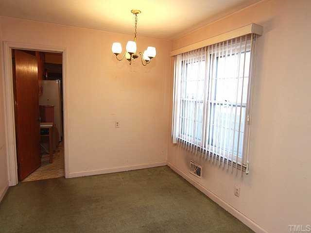 1006 Gregg Street Raleigh, NC 27601 - Photo 5 of 12 a view of an empty room with a window