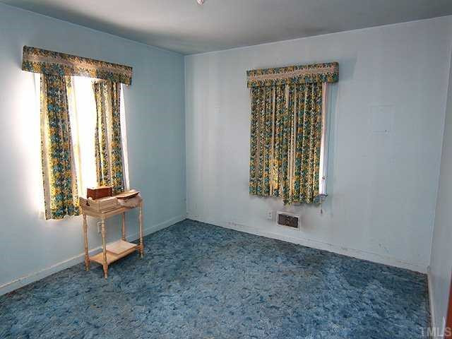 1006 Gregg Street Raleigh, NC 27601 - Photo 8 of 12 an empty room with windows