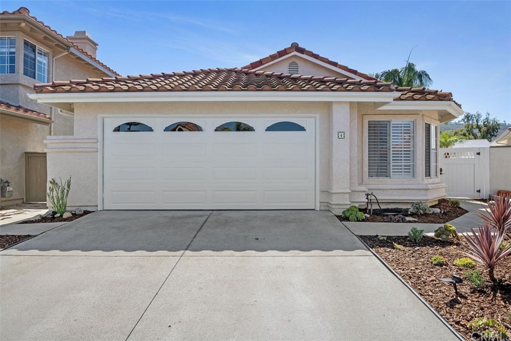 4 Puerto Morant San Clemente, CA 92672 - Photo 1 of 15 a front view of a house with garden