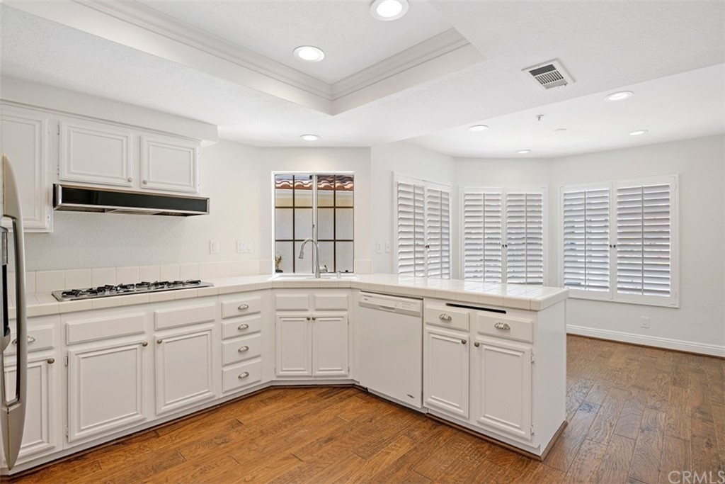 4 Puerto Morant San Clemente, CA 92672 - Photo 6 of 15 a kitchen with granite countertop white cabinets and a large window
