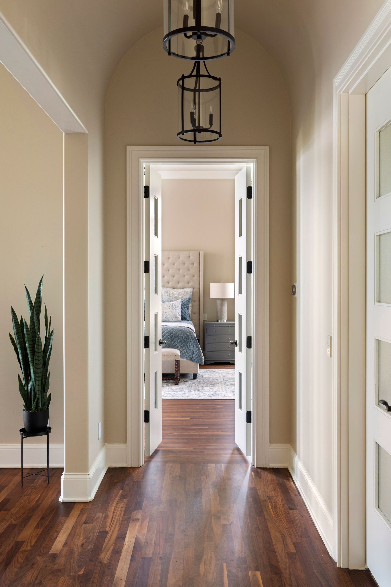 423 Canterbury Rise Franklin, TN 37067 - Photo 26 of 100 a view of a hallway with wooden floor and a chandelier
