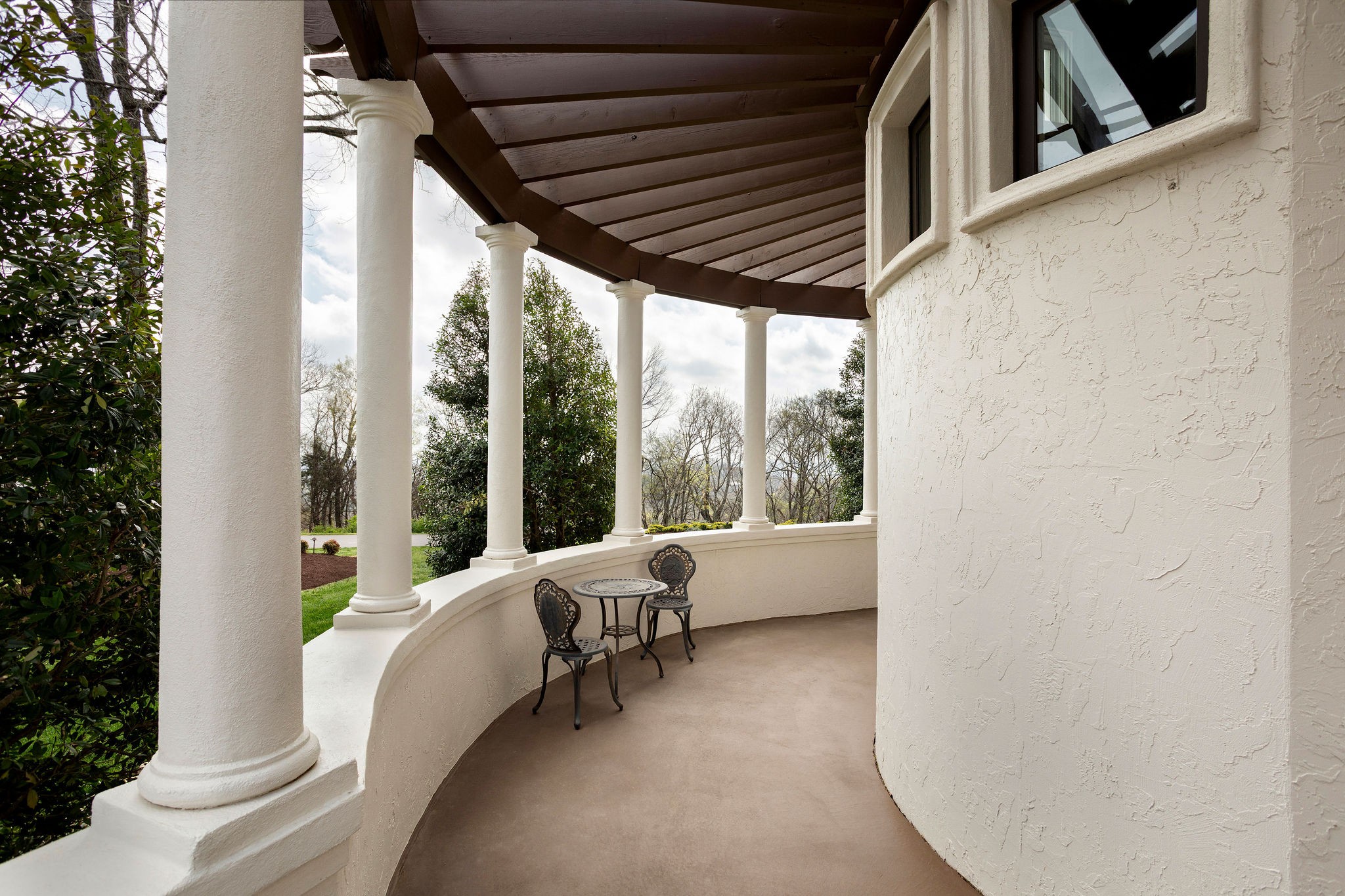 423 Canterbury Rise Franklin, TN 37067 - Photo 42 of 100 a view of a porch with furniture and a yard