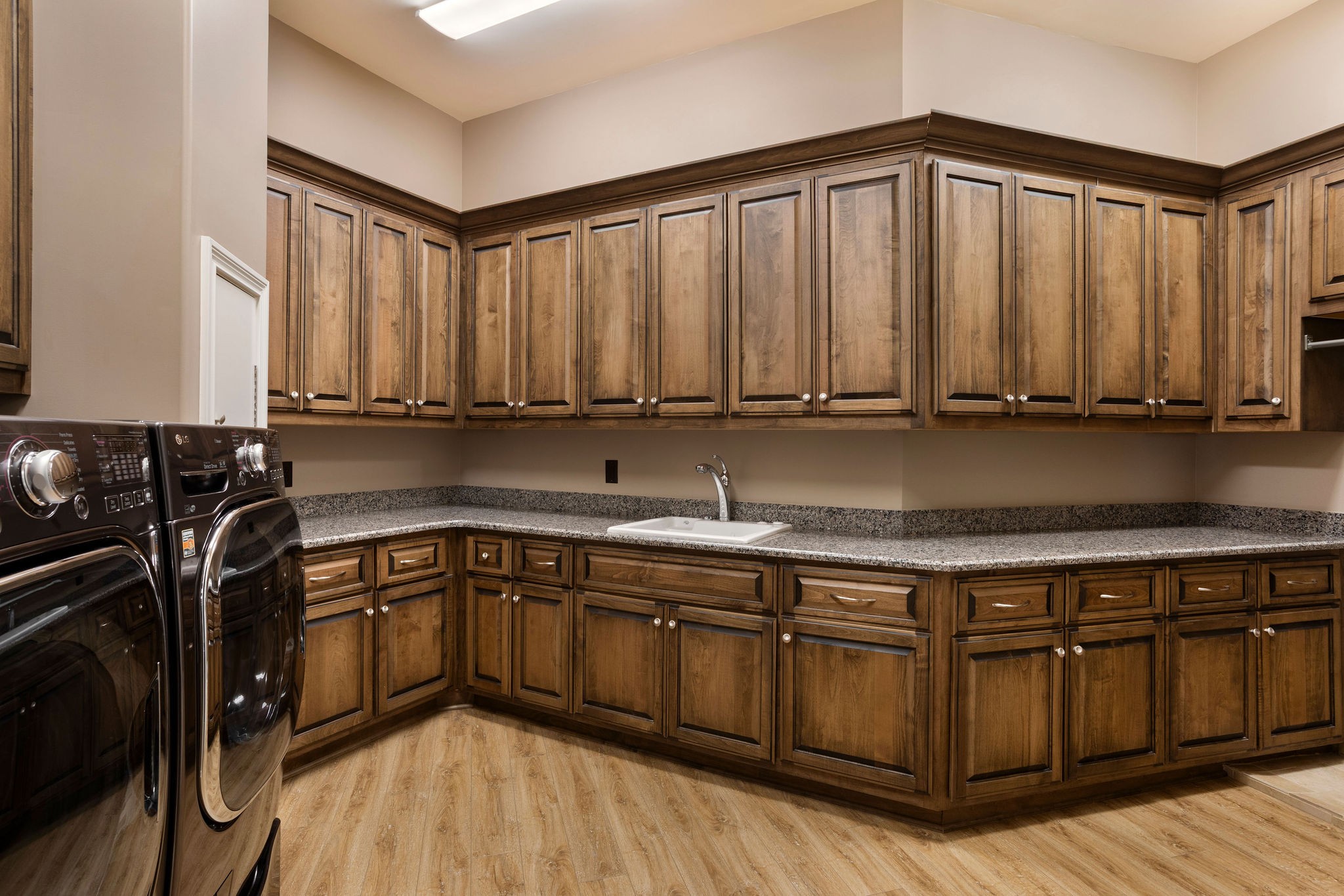 423 Canterbury Rise Franklin, TN 37067 - Photo 68 of 100 a kitchen with stainless steel appliances granite countertop a stove a sink dishwasher and cabinets with wooden floor