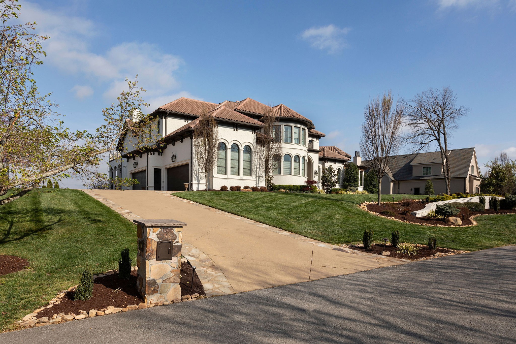 423 Canterbury Rise Franklin, TN 37067 - Photo 88 of 100 a view of a white house with a yard table and chairs