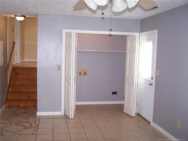 a view of an empty room with a bathroom