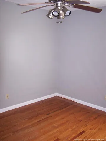 a view of a small space with wooden floor