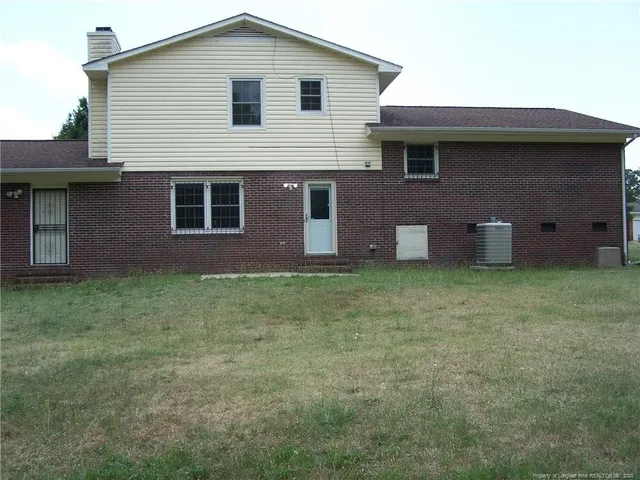 a view of field with trees in the background