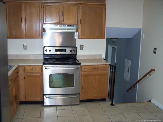 a kitchen with a stove and a microwave
