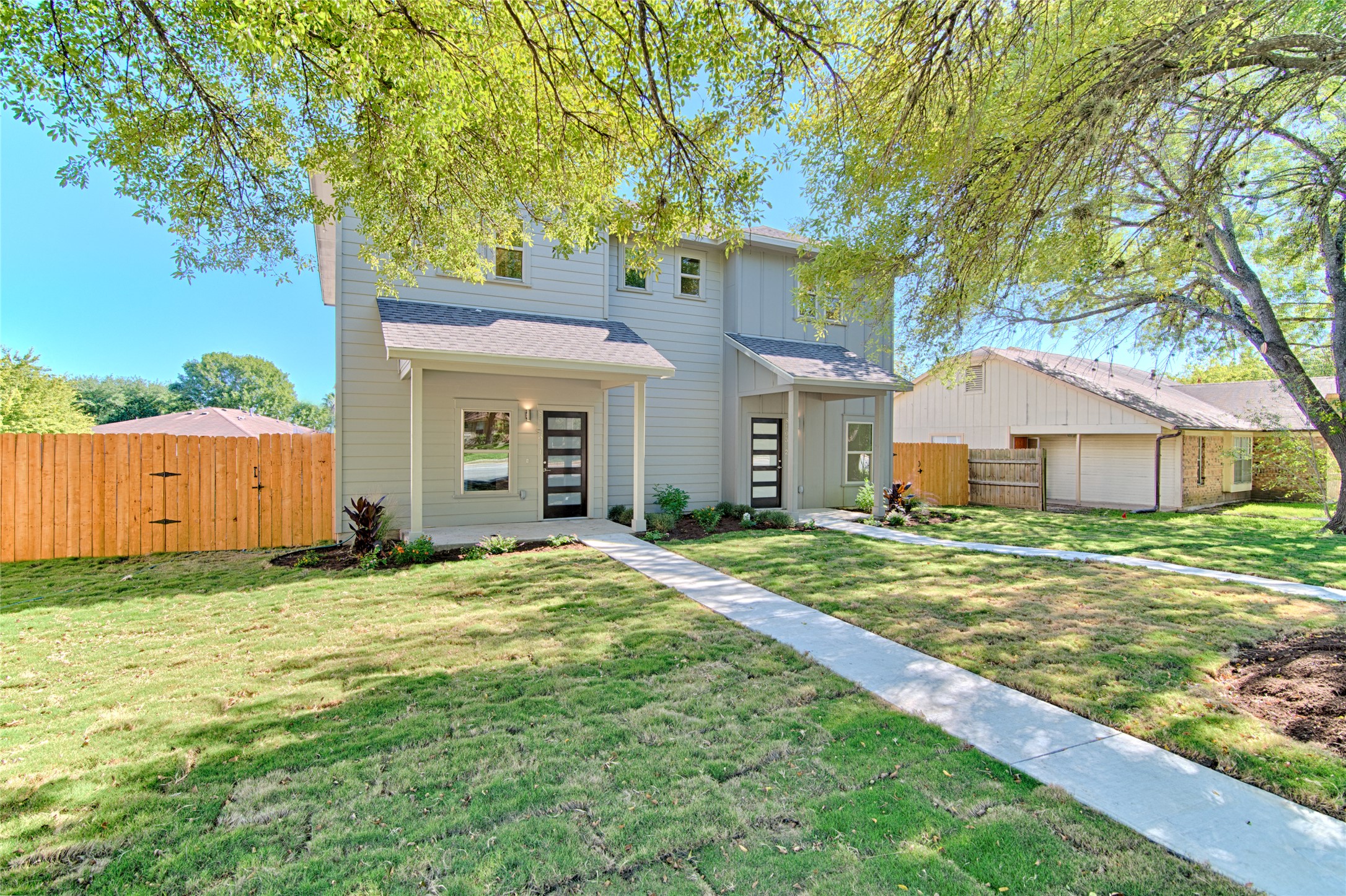8103 West Gate Boulevard, Unit A Austin, TX 78745 - Photo 1 of 1 a house that has a big yard with large trees
