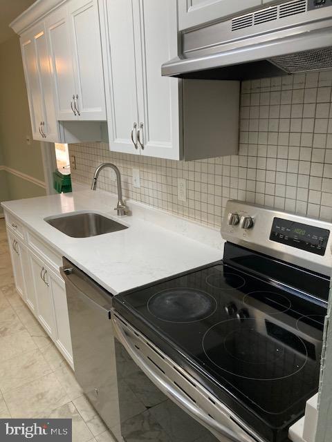 35 Midline Court Gaithersburg, MD 20878 - Photo 3 of 11 Kitchen with new quartz countertops, sink, hardwar