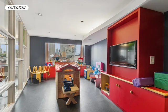 a living room with furniture and large windows