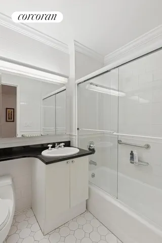 a bathroom with a sink a toilet and a bathtub