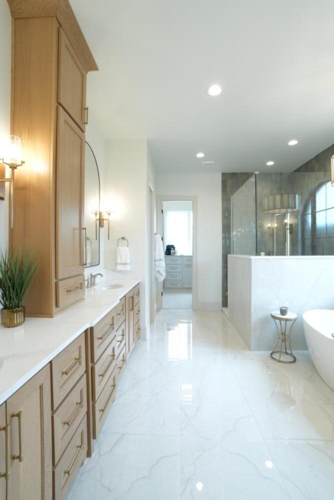 4101 149th Street Lubbock, TX 79423 - Photo 29 of 53 a large bathroom with a large mirror vanity and toilet
