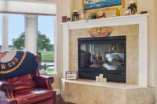 a view of living room kitchen with furniture and outdoor window