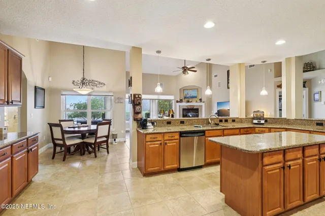 a kitchen with sink stove and cabinets