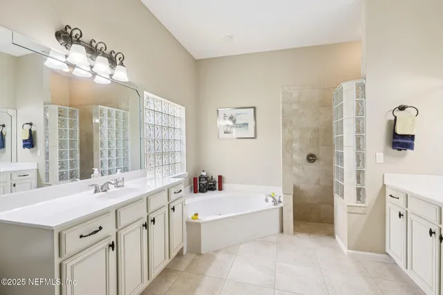a bathroom with a shower and a window