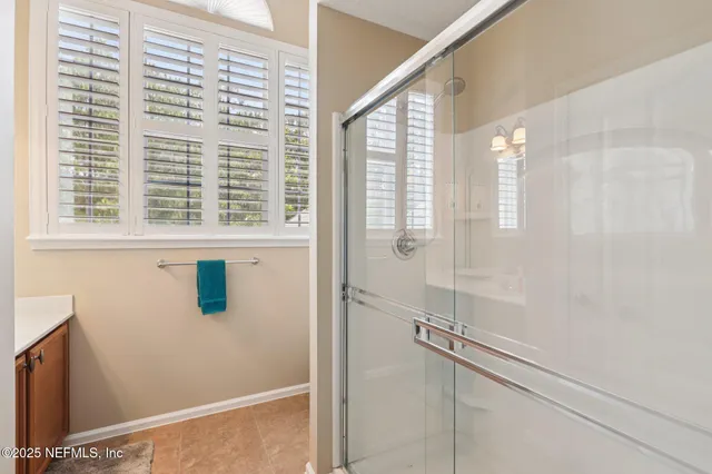 a view of a balcony with chairs and a table