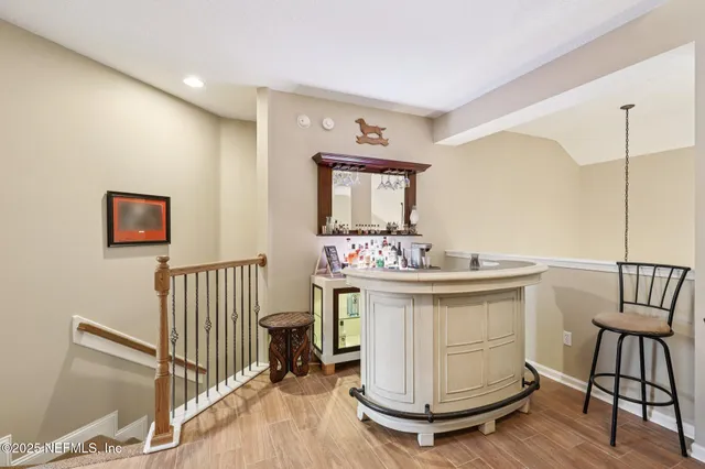 a backyard of a house with lots of green space and lake view