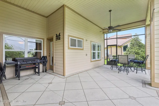 an aerial view of residential houses with outdoor space and river