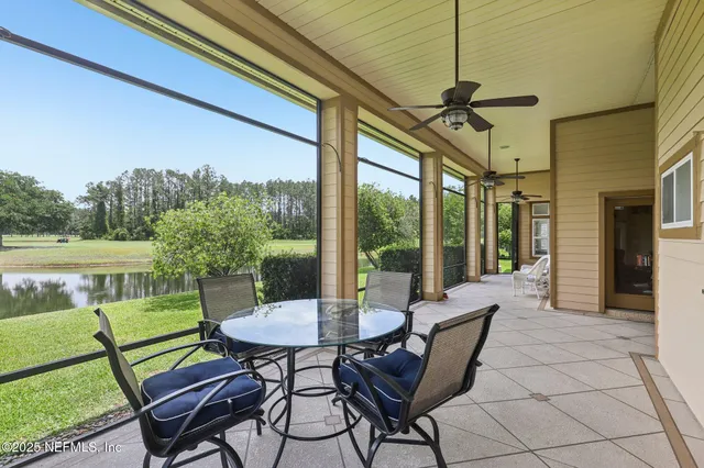 an aerial view of a house with garden space and ocean view