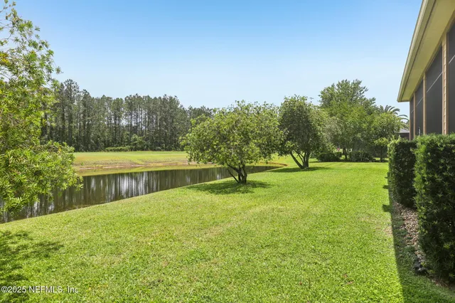 an aerial view of a house with a garden