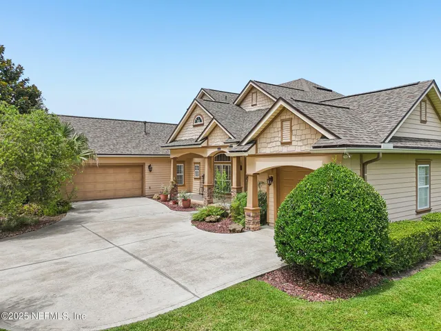 an aerial view of a house with mountain view