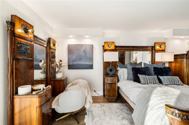 a bedroom with a bed window and couch