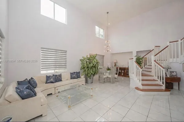 a bedroom with furniture and a potted plant